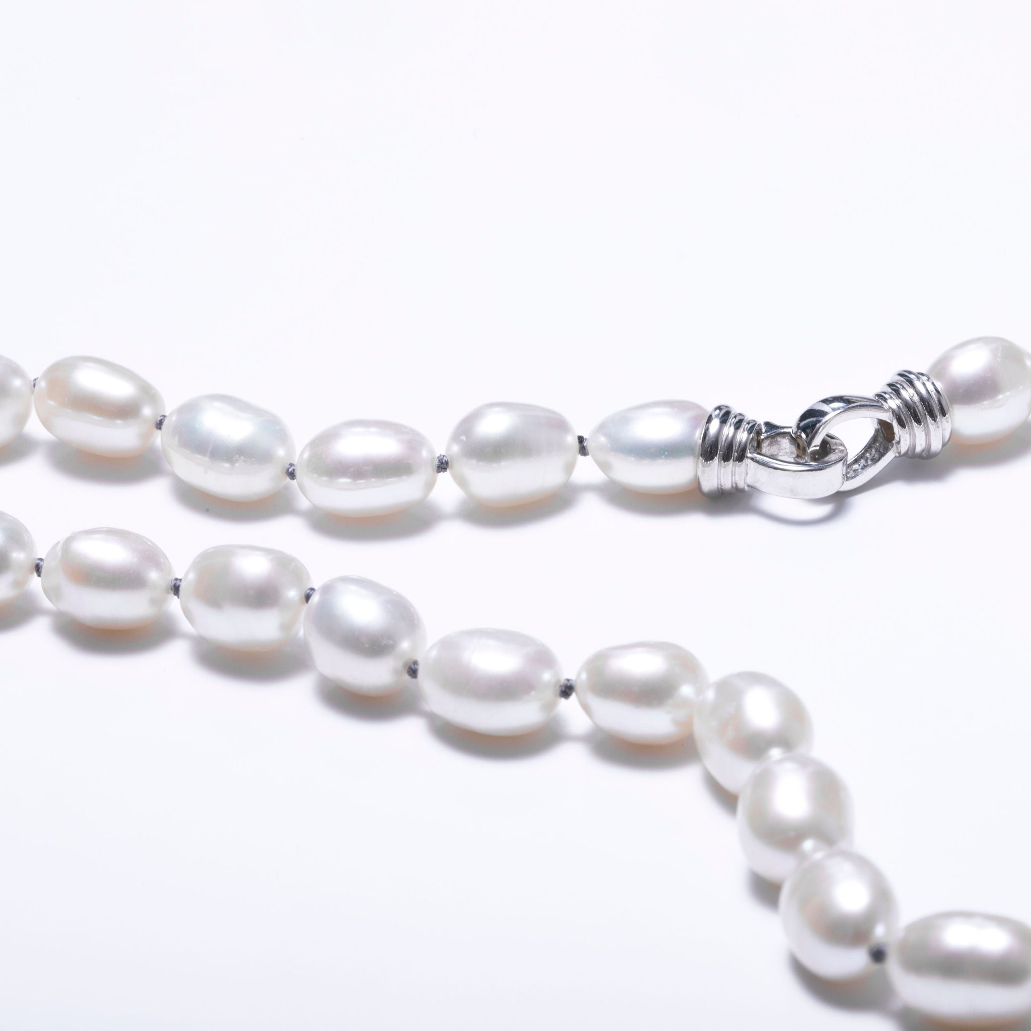 White freshwater pearl necklace mounted on black wire