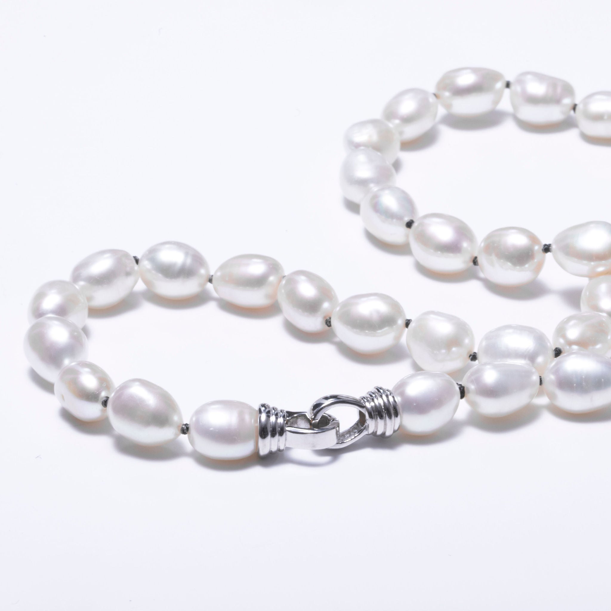 White freshwater pearl necklace mounted on black wire